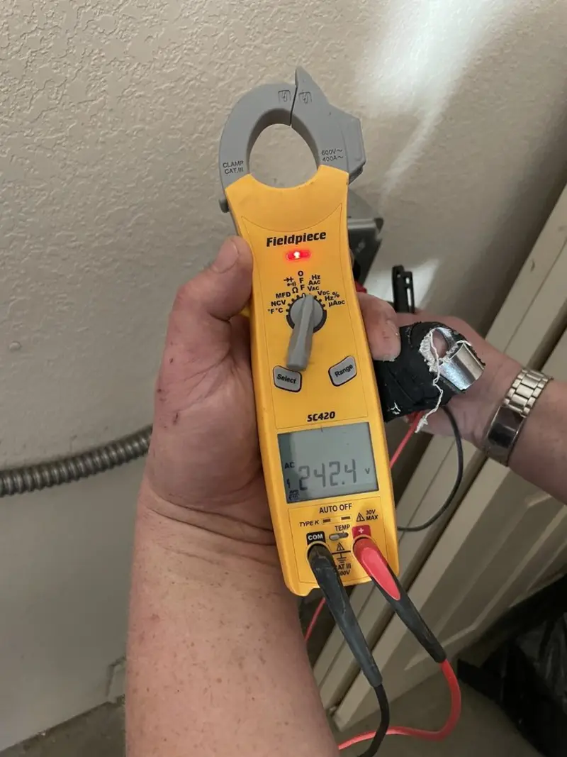 Voltage testing with clamp meter during Electrical Installation Services in Wolcott